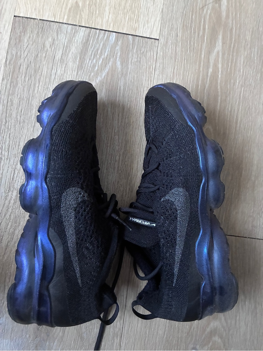 Nike Men's Black Flyknit Sneakers with Iridescent Blue Sole